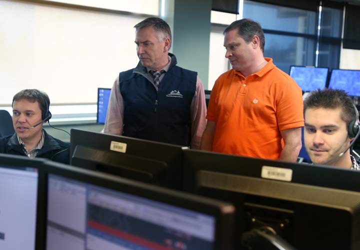 FVRD’s CAO Paul Gipps (centre, left) and Manager of E911 & Information Technology Randy Castle look on as E-Comm becomes the first point of contact for 9-1-1 callers in the Upper Fraser Valley.