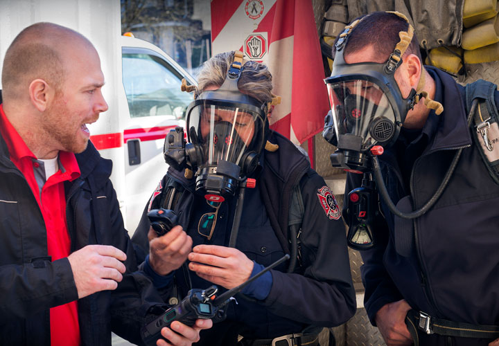 E-Comm’s wireless team assists Vancouver Fire and Rescue Services in testing noise cancellation technology when wearing a compressed breathing apparatus.