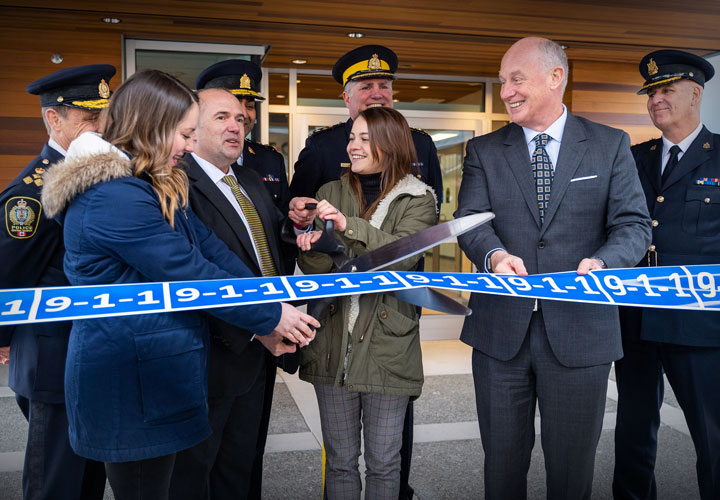 Cutting the “9-1-1” ribbon to mark the opening of the South Island 9-1-1/Police Dispatch Centre on March 6, 2019.